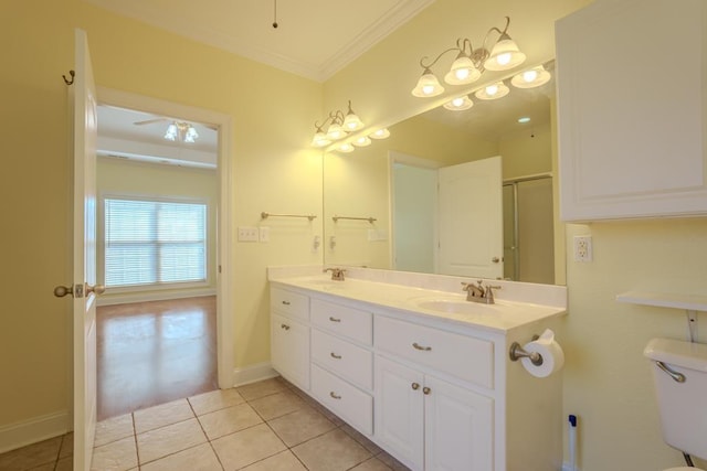 bathroom featuring ceiling fan, walk in shower, tile patterned floors, vanity, and ornamental molding