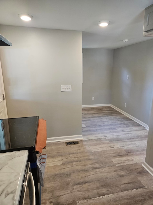 laundry area with light wood-type flooring