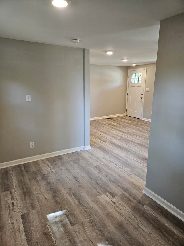 empty room featuring hardwood / wood-style flooring