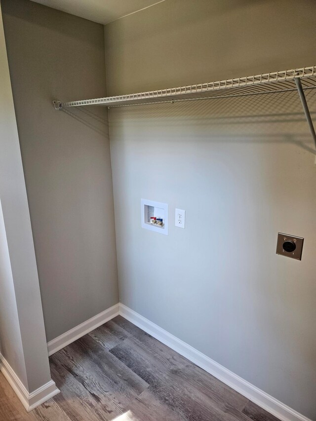 laundry area with wood-type flooring, washer hookup, and hookup for an electric dryer