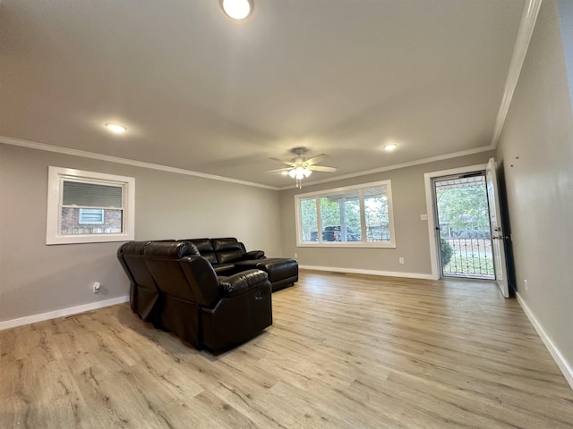 living room featuring light wood-type flooring, ceiling fan, and ornamental molding