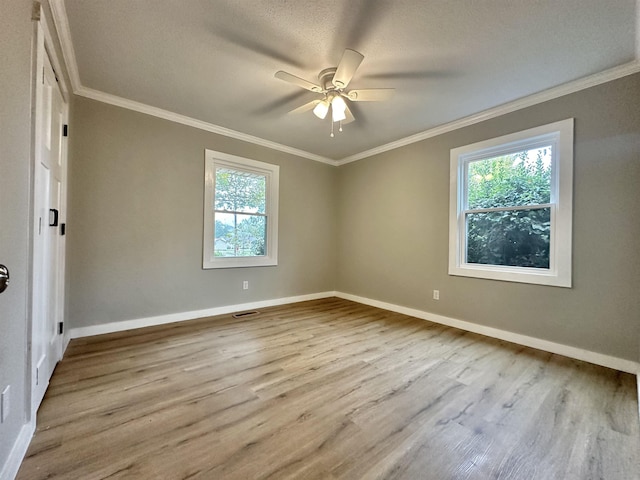 unfurnished room featuring a textured ceiling, ceiling fan, crown molding, and light hardwood / wood-style flooring