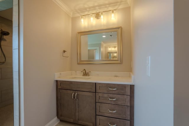 bathroom with ornamental molding and vanity