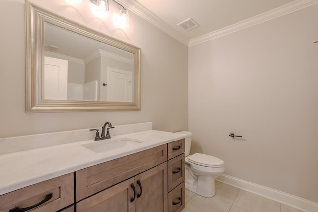 bathroom with tile patterned flooring, crown molding, vanity, and toilet