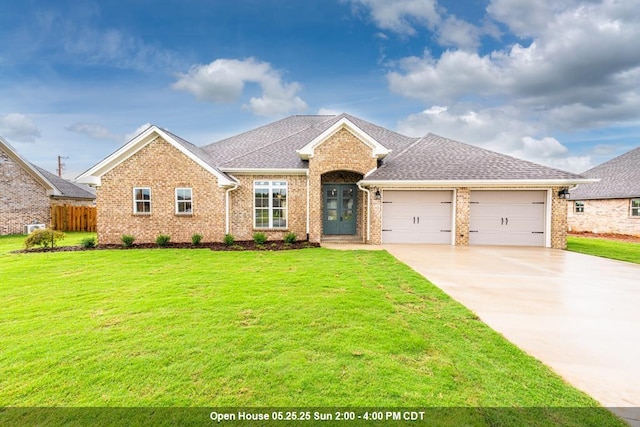  - view of front of home featuring a garage, brick siding, concrete driveway, and roof with shingles