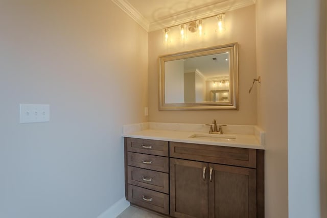 bathroom with ornamental molding and vanity