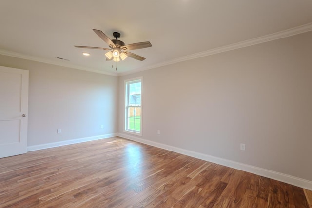 empty room featuring crown molding, light hardwood / wood-style floors, and ceiling fan