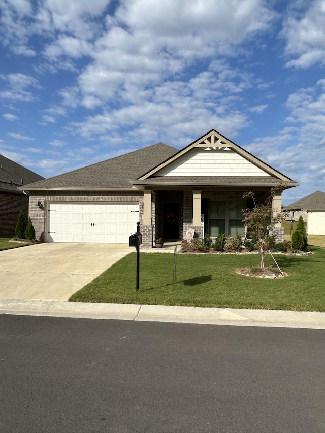 craftsman inspired home featuring a garage and a front lawn