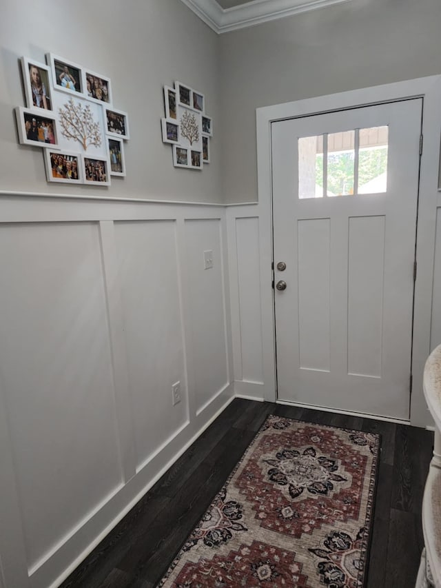 doorway to outside with dark hardwood / wood-style floors and ornamental molding