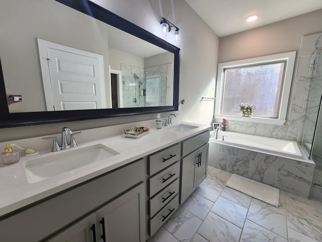 bathroom featuring vanity and shower with separate bathtub