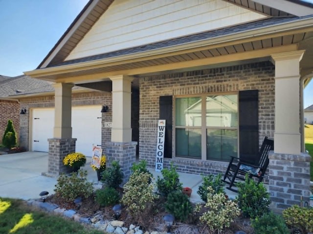 exterior space with a porch and a garage