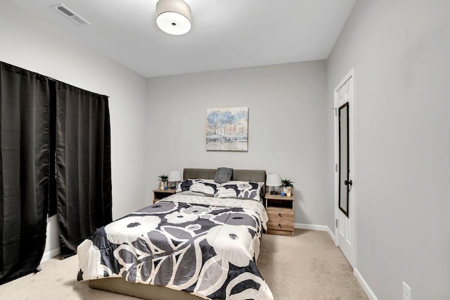 bedroom with carpet flooring, visible vents, and baseboards