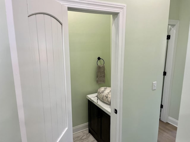 bathroom with vanity and hardwood / wood-style floors