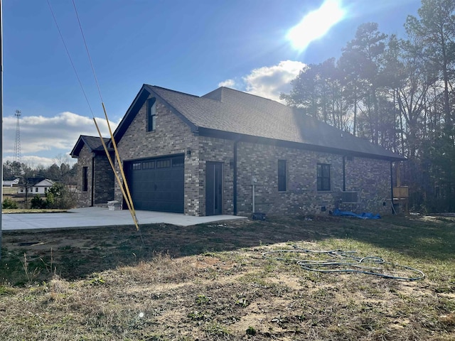 view of property exterior with a garage