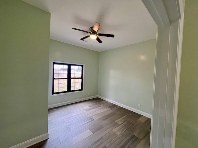 unfurnished room with ceiling fan and light hardwood / wood-style flooring