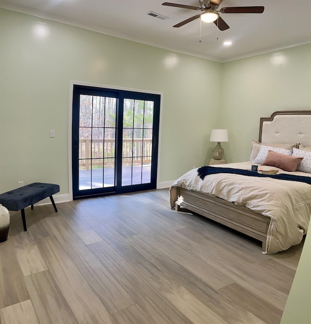 bedroom with access to outside, ornamental molding, light wood-type flooring, and ceiling fan