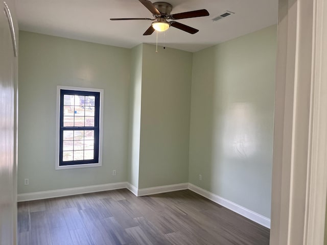 unfurnished room featuring hardwood / wood-style floors and ceiling fan