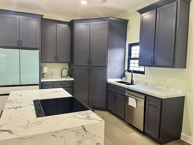 kitchen featuring sink, light wood-type flooring, stainless steel dishwasher, and gray cabinets