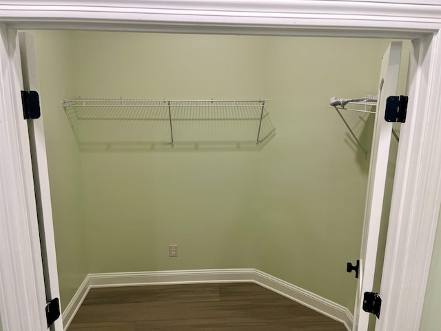 walk in closet featuring hardwood / wood-style flooring