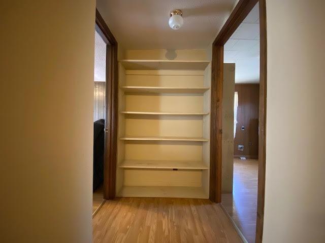 hallway featuring wood finished floors