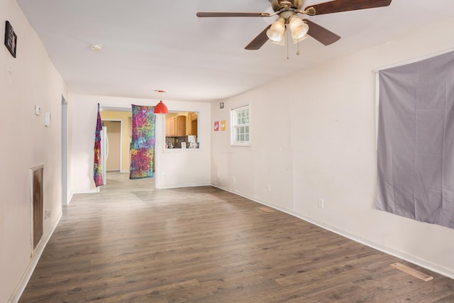  - unfurnished room featuring wood finished floors and ceiling fan