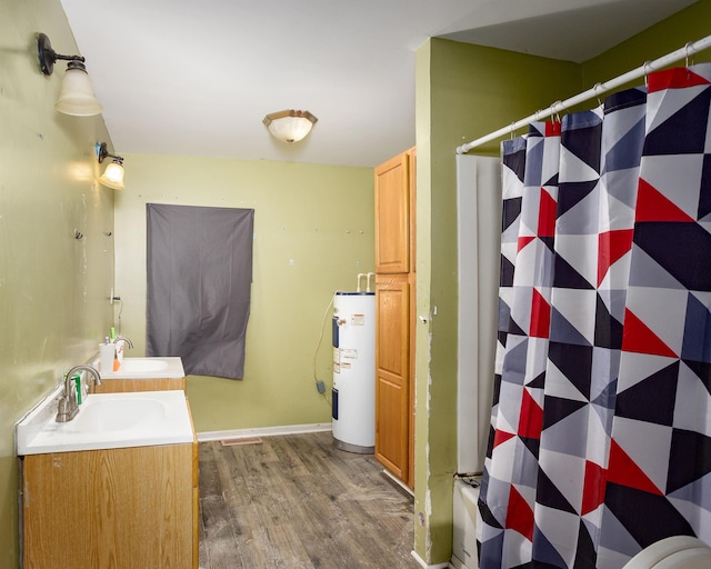 - full bath featuring water heater, wood finished floors, double vanity, and a shower with curtain