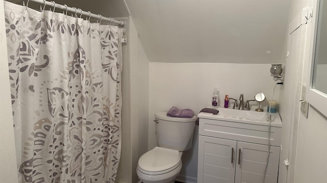 bathroom with a shower with curtain, vanity, toilet, and lofted ceiling