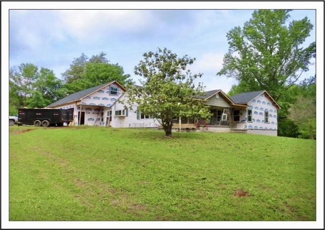 20 Arnold Ln, Florence, AL - rear view of property featuring a lawn and a porch