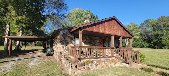 view of front of home with a front yard and a porch