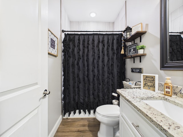 - full bath featuring vanity, a shower with shower curtain, and wood finished floors