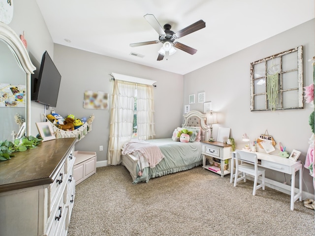  - bedroom with light colored carpet and a ceiling fan