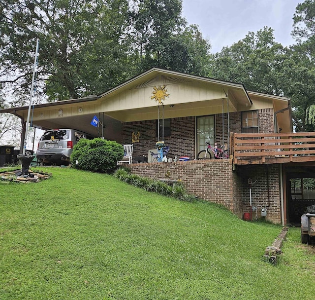 1816 Briarwood Ln SE, Cullman, AL - rear view of property with brick siding, a lawn, and an attached carport