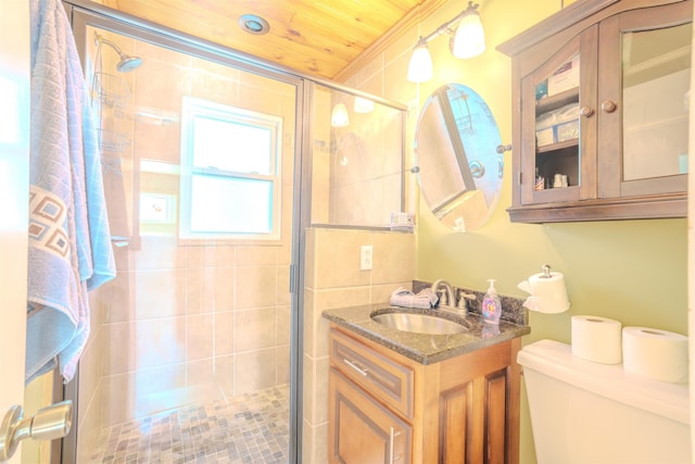 full bathroom featuring toilet, vanity, wooden ceiling, and a stall shower