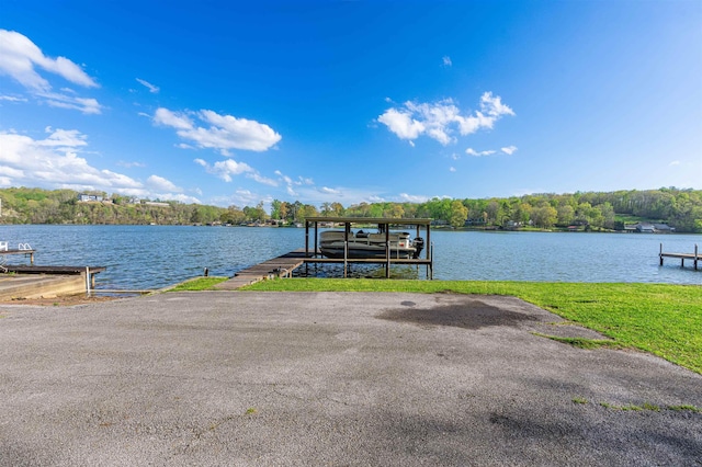 view of dock featuring boat lift and a water view