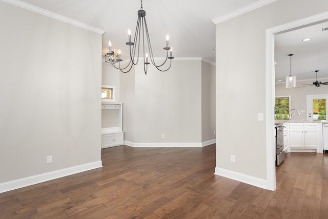 unfurnished dining area featuring ceiling fan with notable chandelier, crown molding, and dark wood-type flooring