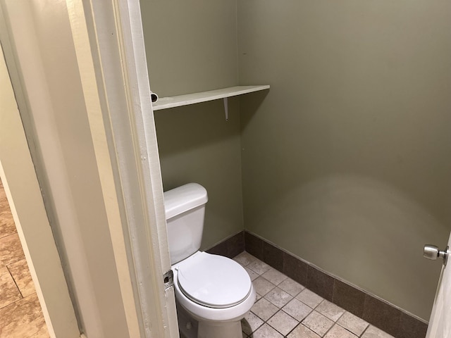 bathroom with tile patterned floors and toilet