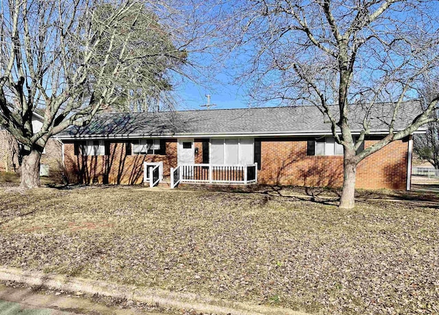 ranch-style home with a front lawn