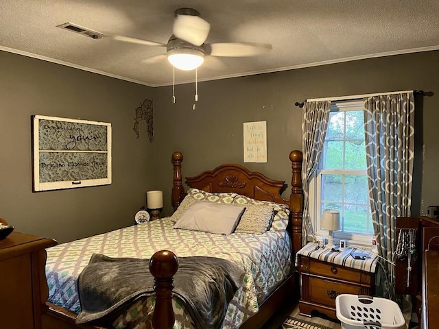  - bedroom featuring a textured ceiling, ornamental molding, and ceiling fan