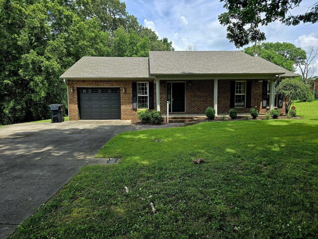  - rear view of property featuring brick siding, a lawn, and a deck