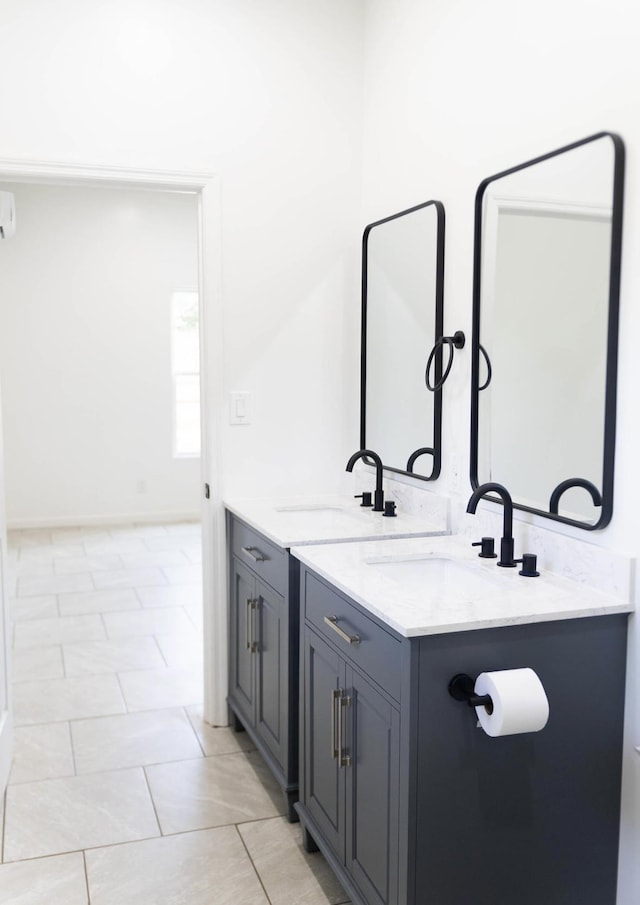  - bathroom featuring double vanity