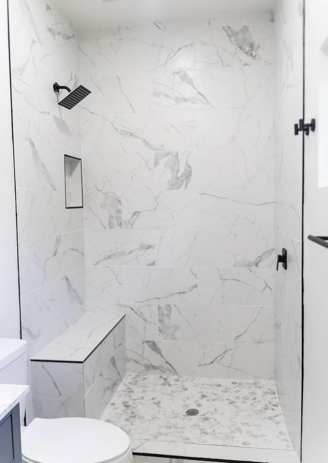  - full bath featuring a marble finish shower and vanity