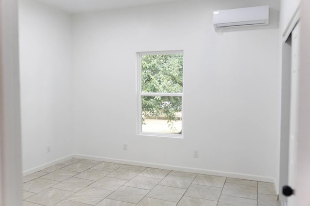  - empty room with a wall unit AC and baseboards