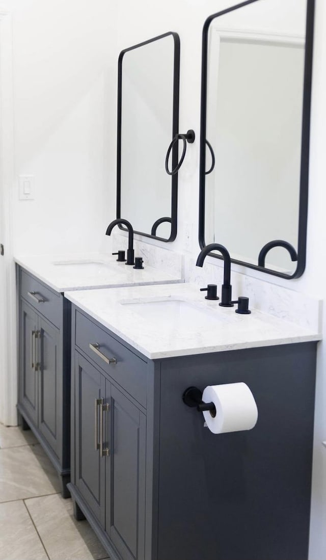  - bathroom with double vanity and tile patterned flooring