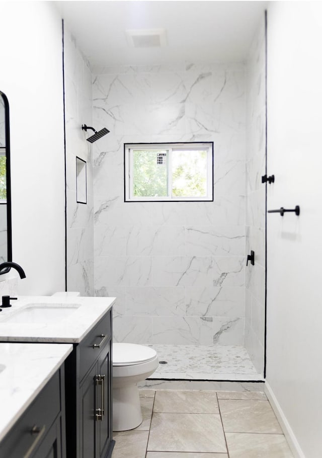  - full bathroom featuring vanity, a marble finish shower, and marble finish flooring