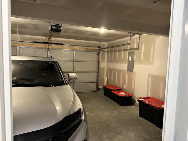 garage with electric panel and a garage door opener