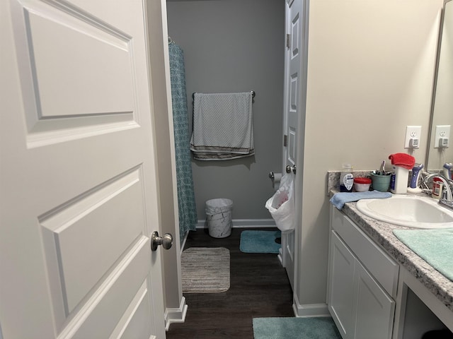 bathroom featuring vanity and wood-type flooring