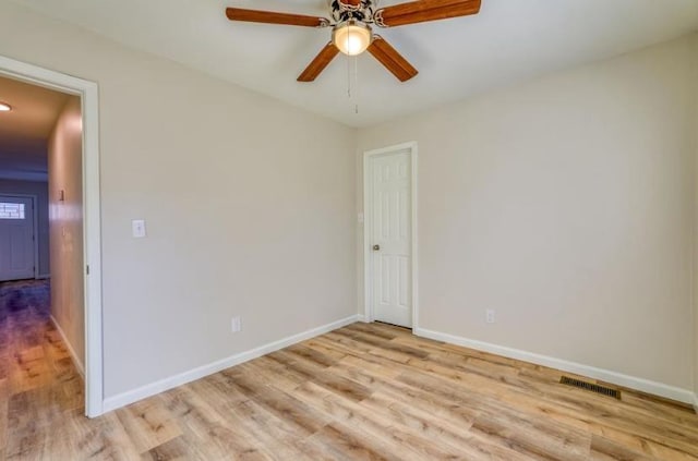 unfurnished room featuring light wood-type flooring and ceiling fan