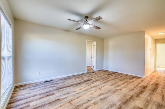 empty room featuring light hardwood / wood-style floors and ceiling fan