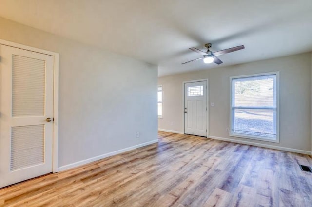 interior space with light hardwood / wood-style flooring and ceiling fan