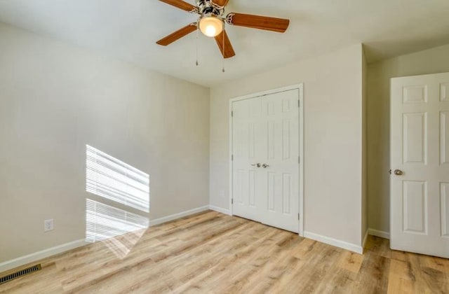 unfurnished bedroom with a closet, ceiling fan, and light hardwood / wood-style floors